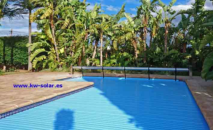 Automatic pool cover with blue slats and stainless steel roller